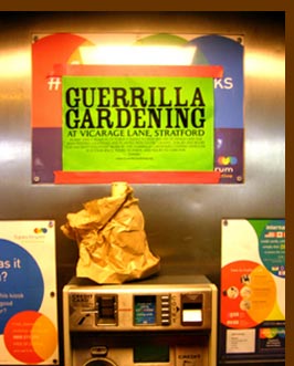 Guerrilla Gardening poster in a phone box