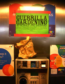 Guerrilla gardening propaganda in a phone box